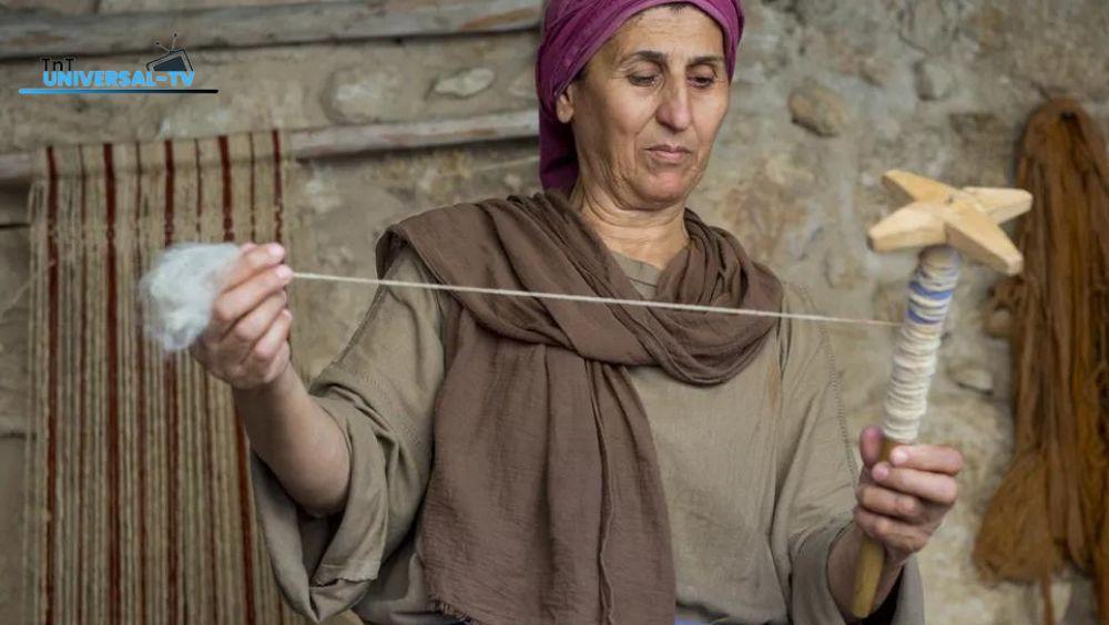 Palestinian women display their handicrafts for sale in an ancient cave